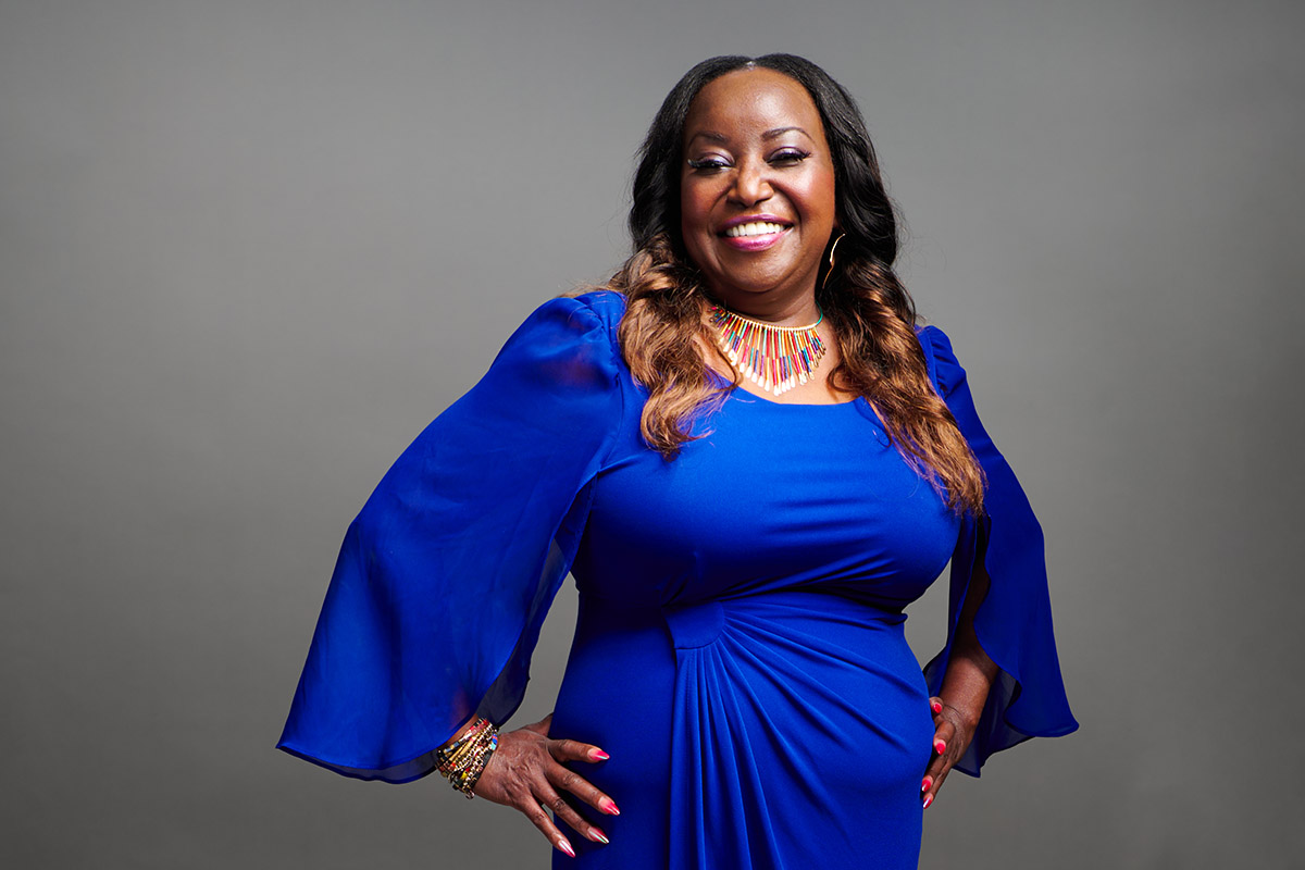 Esther, a breast cancer survivor, smiling confidently