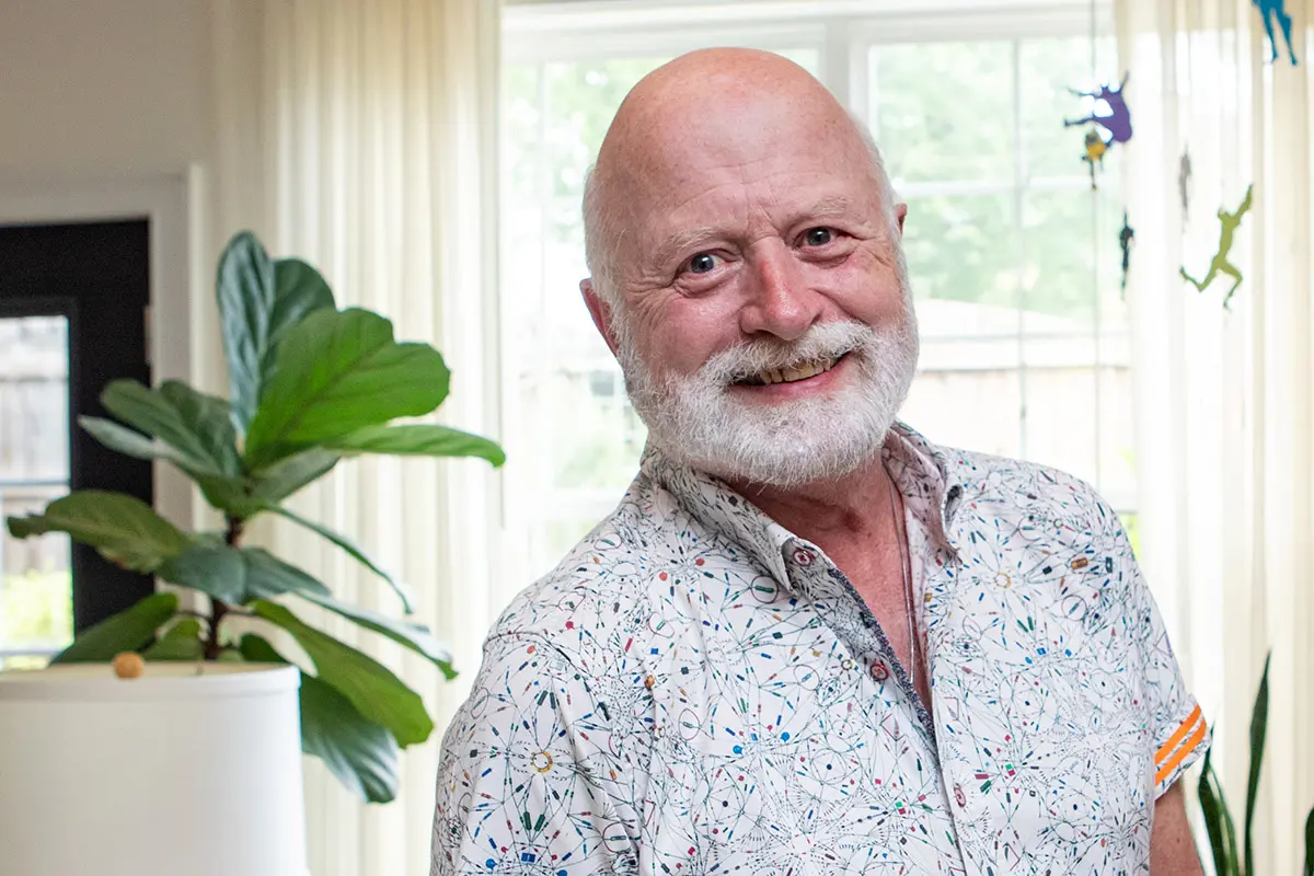 Tom, a prostate cancer survivor, smiling at home